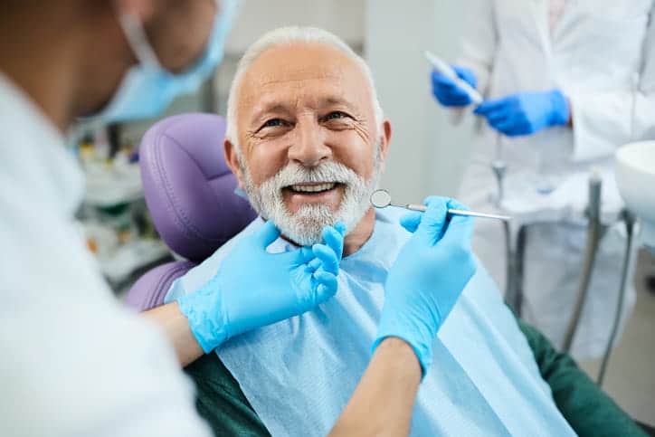 An older man smiling at the general dentist in las vegas, nevada.