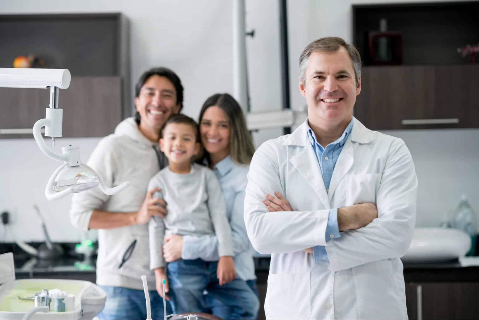 Dentist with Patient & Family
