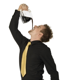 A man drinking coffee ruining his white teeth
