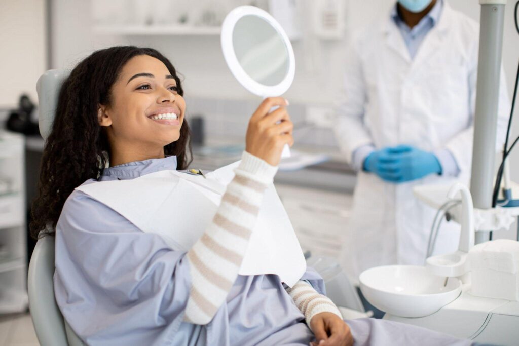 Lady Smiling in Dentist Office