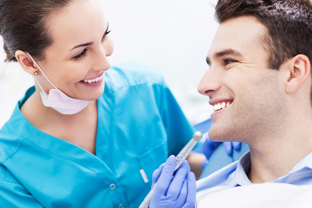 Dentist patient getting teeth whitening