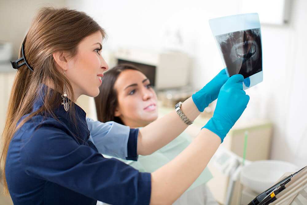 dentist showing x-ray of underbite