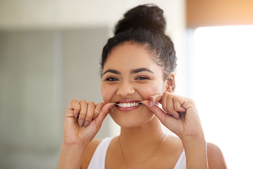 Flossing helps clean teeth and gums