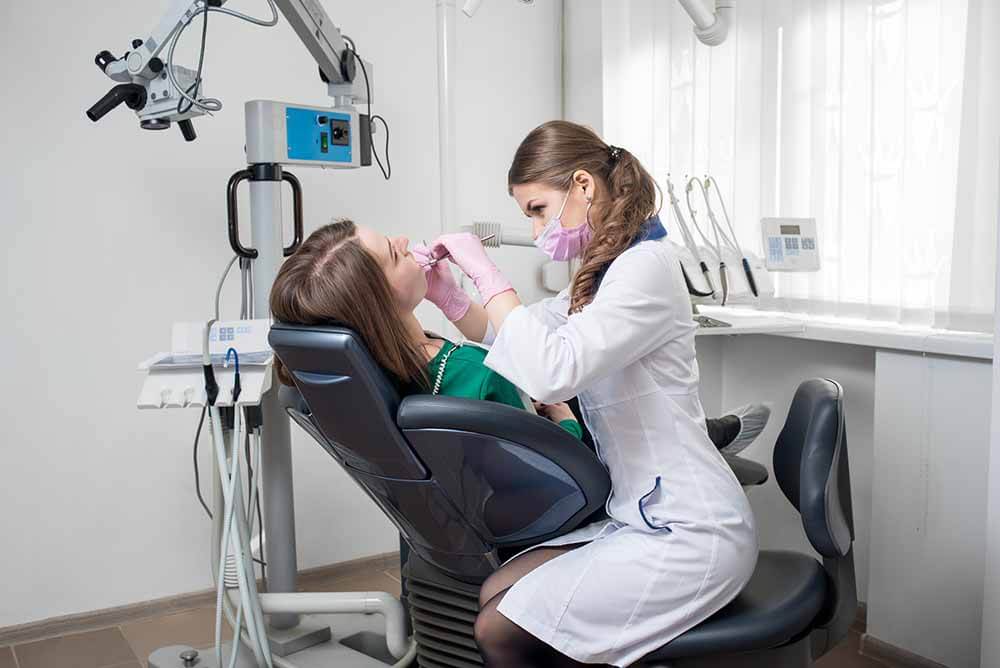 Woman getting dental implant surgery