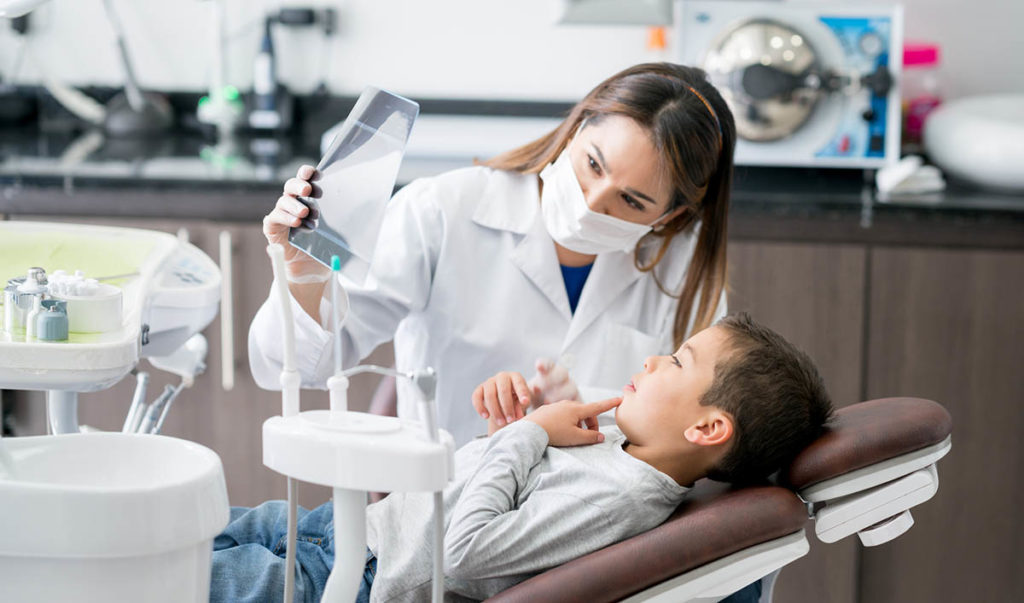 Pediatric Dentist at Absolute Dental showing child x-ray