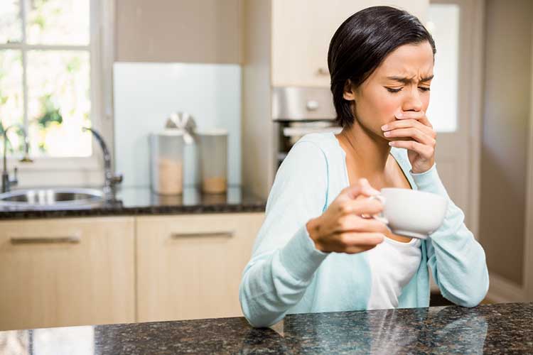 Woman with tooth sensitivity