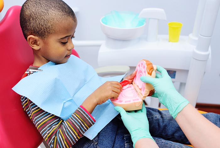 Kid in dentist chair