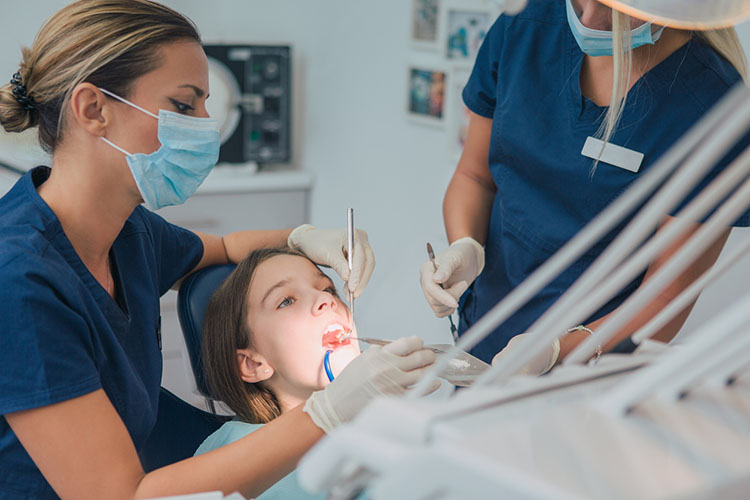 Child at dentist getting treatment