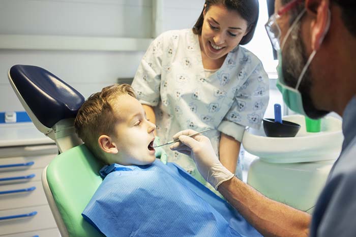 Child getting a dental exam