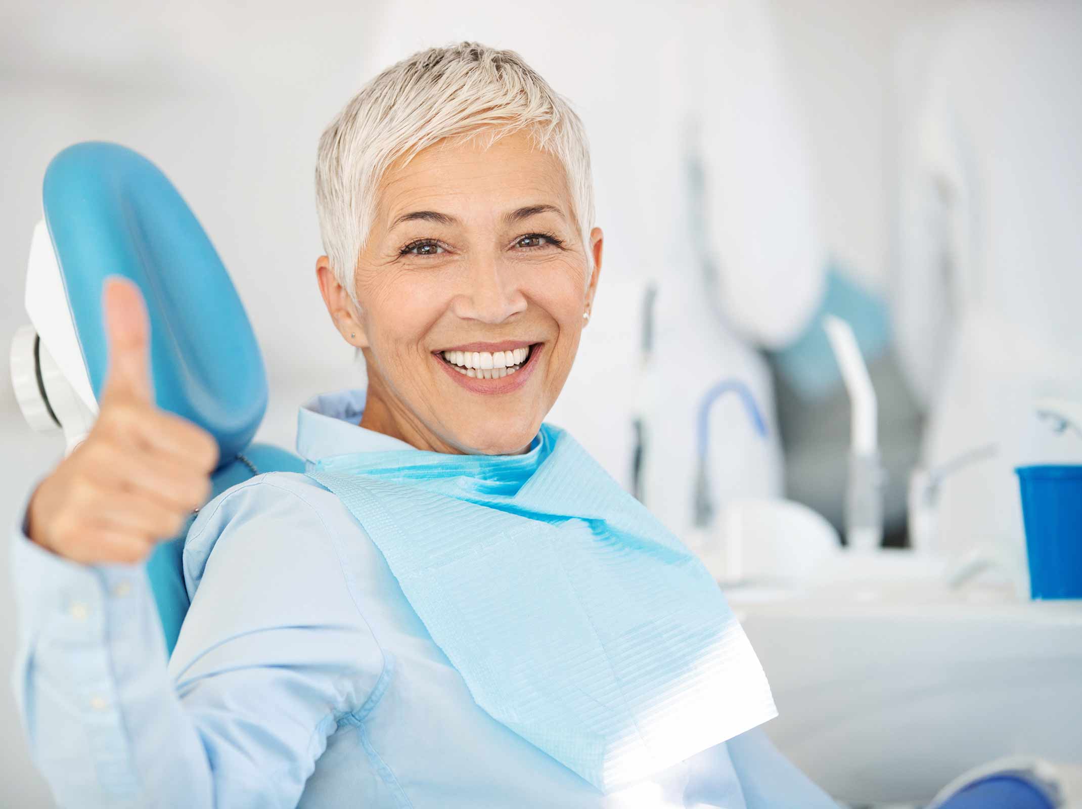 woman getting her teeth whitened at Absolute Dental