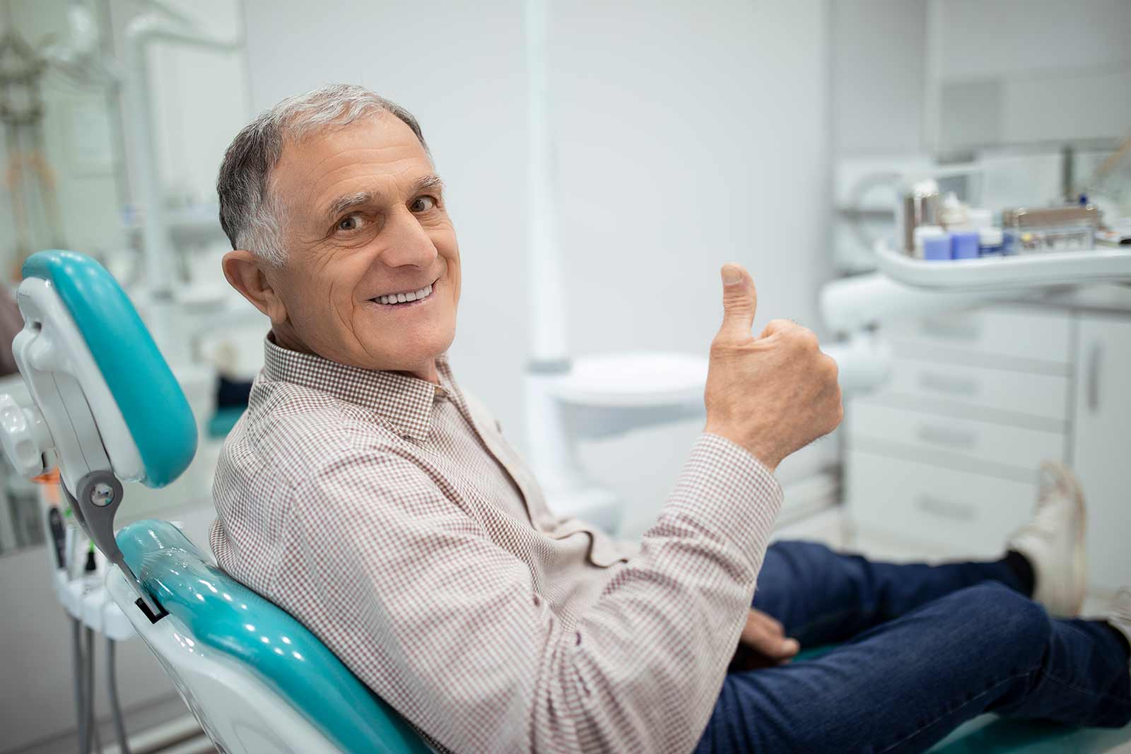 male patient getting his dental crowns taken care of at the dental