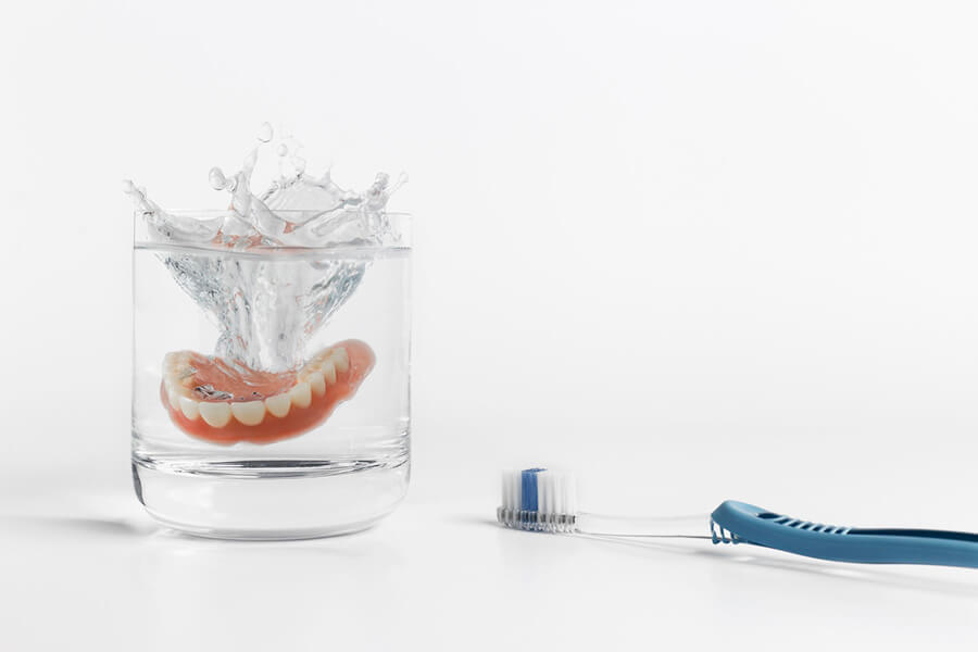 dentures in cleaning solution