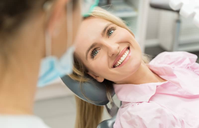 Woman smiling at family dentist in Carson City