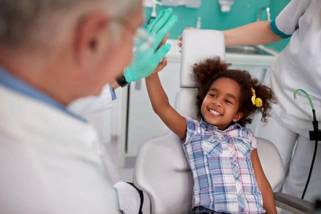 toddler being friendly with a new dentist