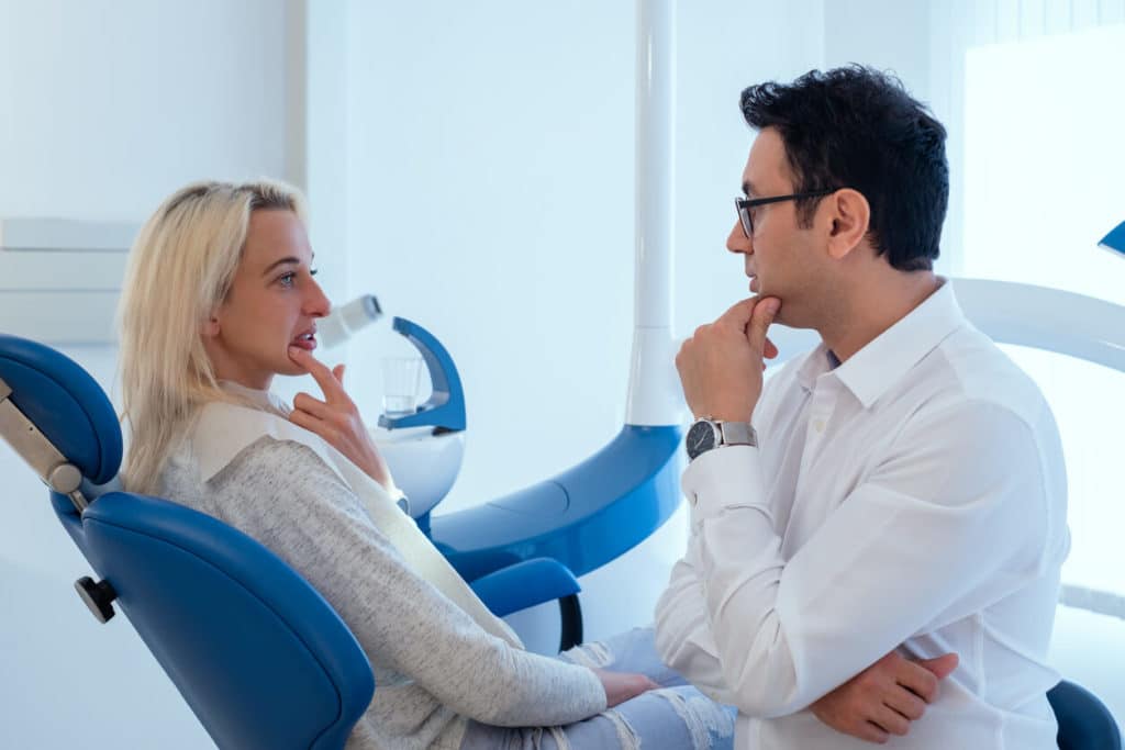 Dentist-talking-to-patient