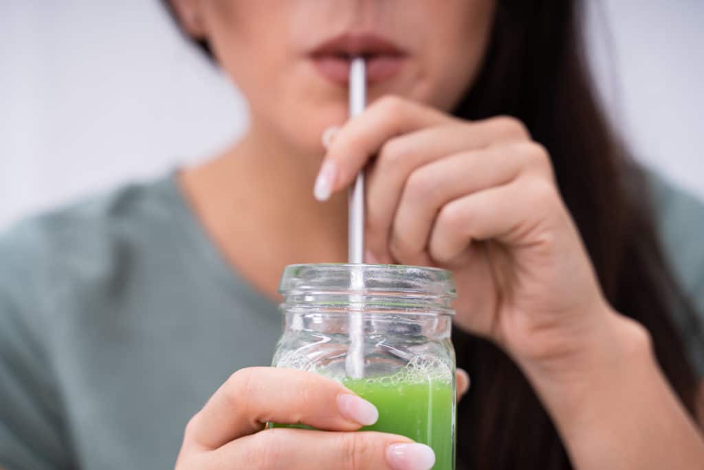 Woman-drinking-from-a-straw