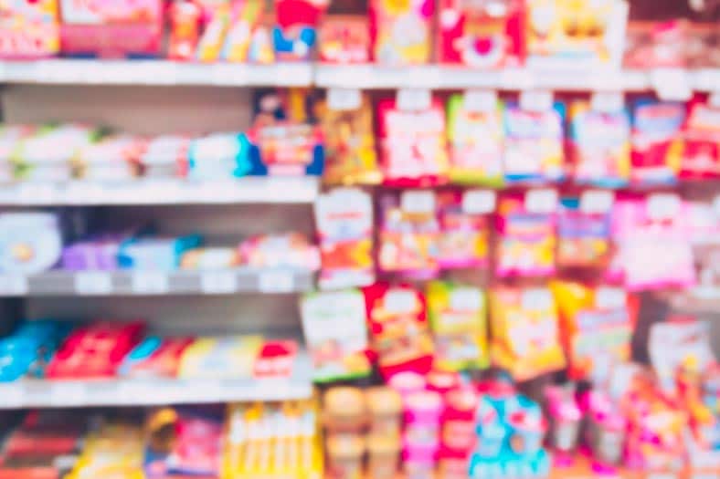 11 Common Foods That Cause Cavities In Kids 2 Candies in grocery store candy aisle