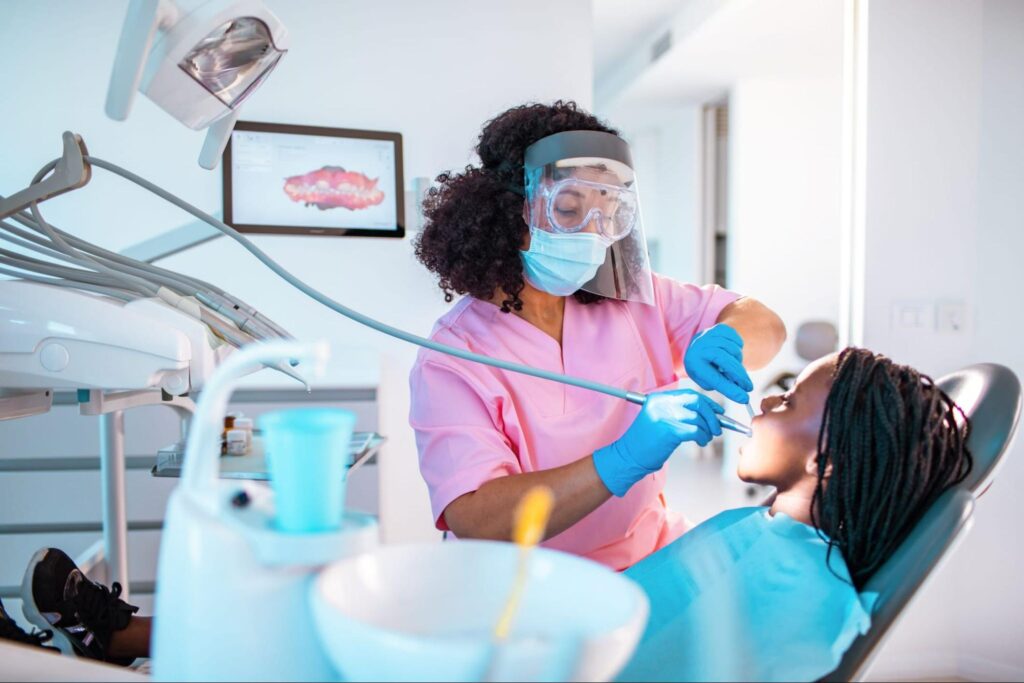 Dentist working on child's teeth