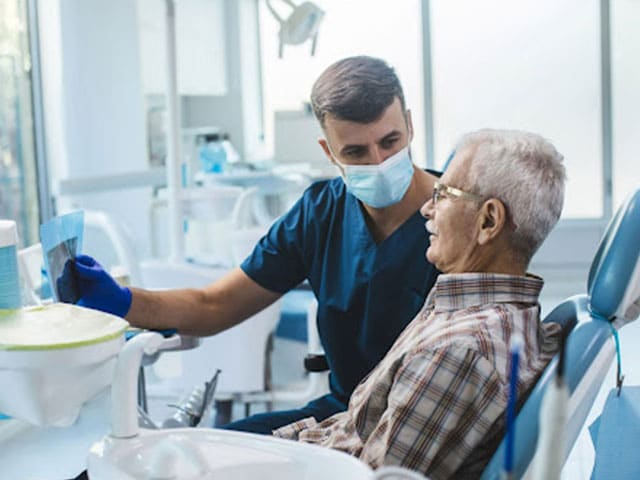 Dentist Helping Patient