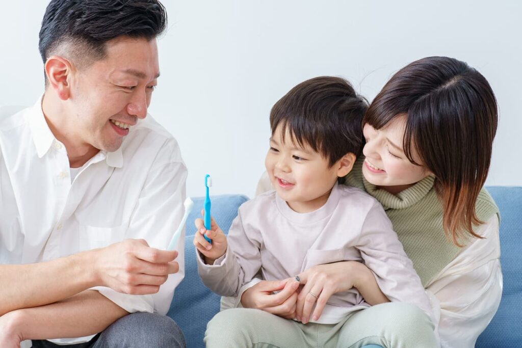 A family smiling after seeing their dentist on Fort Apache in Las Vegas.