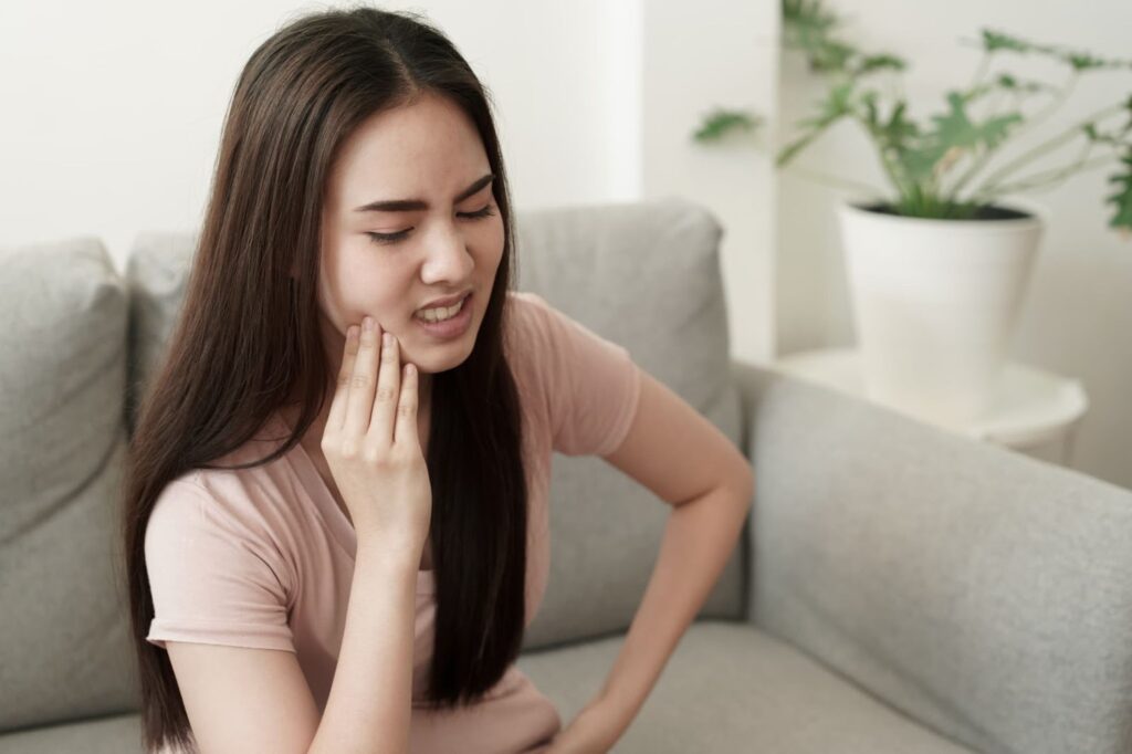 Woman in Pain from Wisdom Tooth Impact