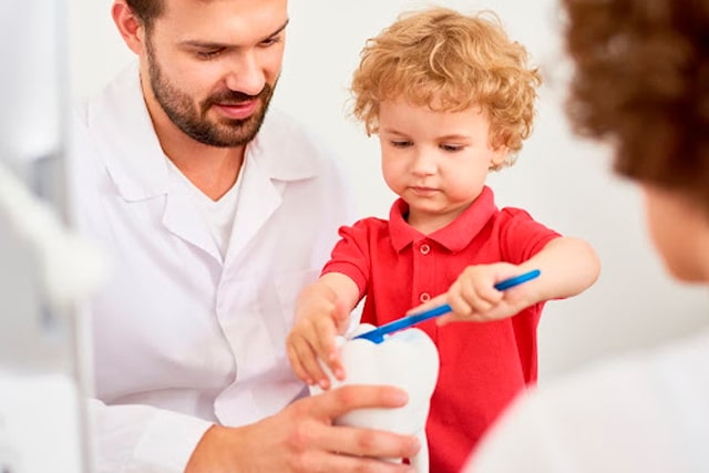 Pediatric Dentist with Child