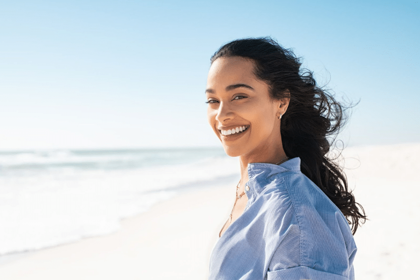 Smiling woman after wisdom teeth extraction