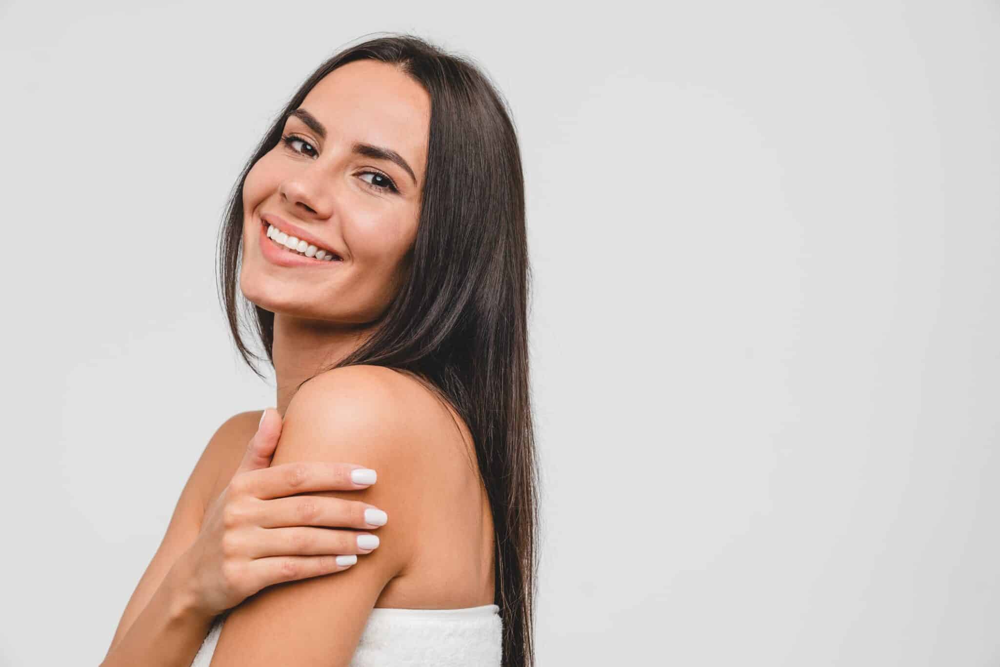 Smiling woman with dental sealants scaled