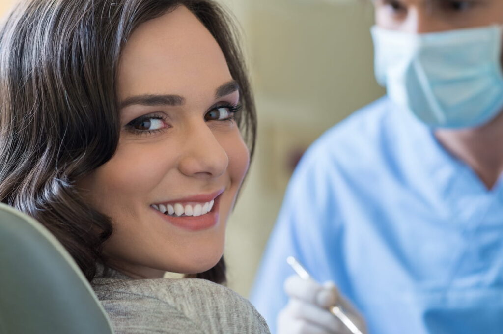 A woman smiling at the dentist's office in Sparks, NV. 