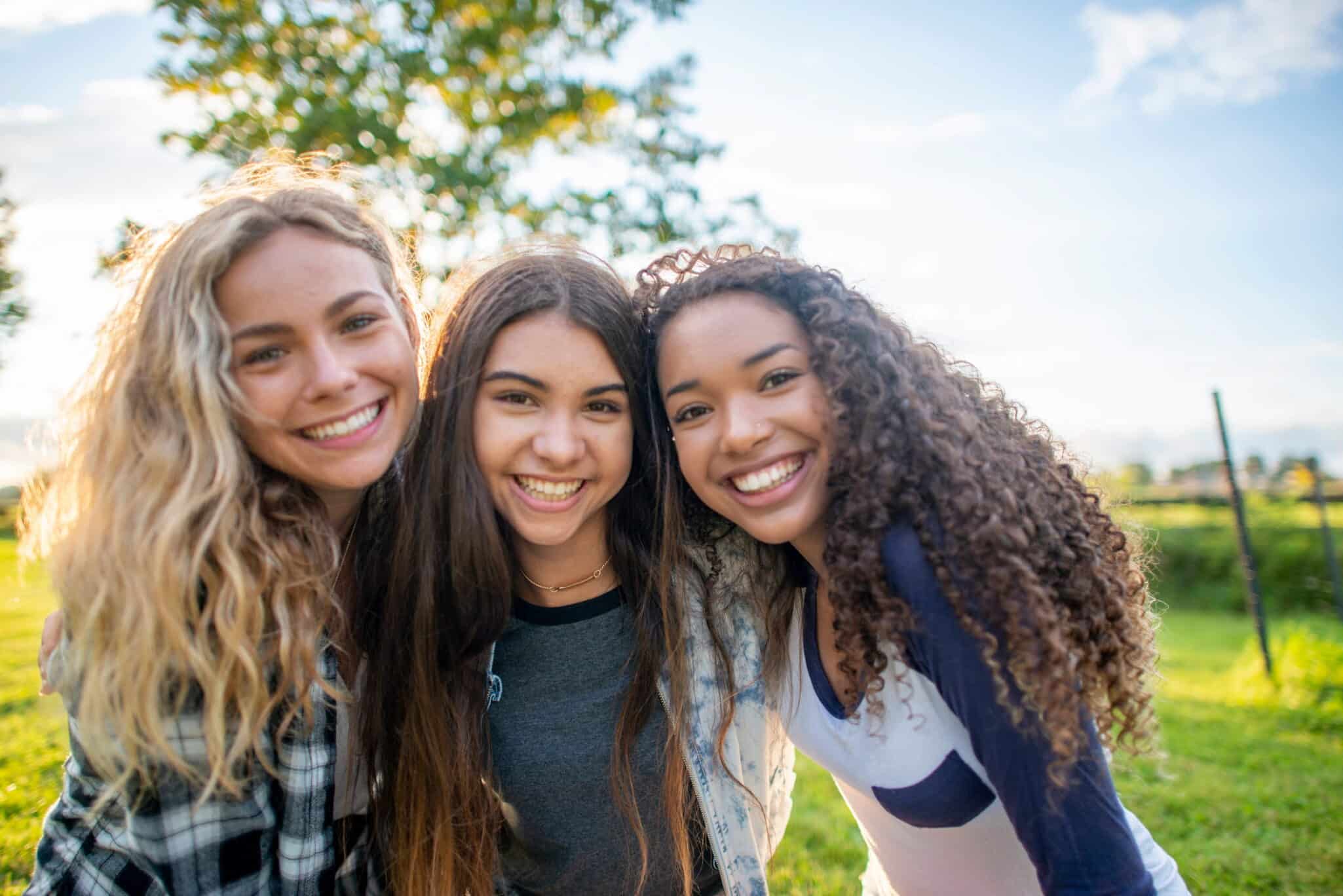3 Young Women Smiling