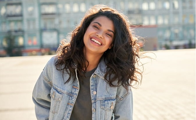 A woman smiling.