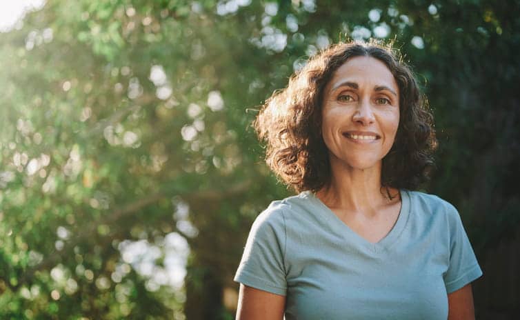 A woman smiling.