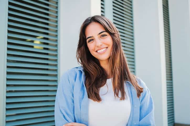 A woman smiling.