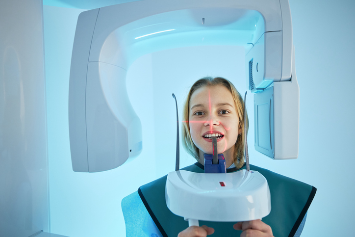 Girl getting x-ray of teeth